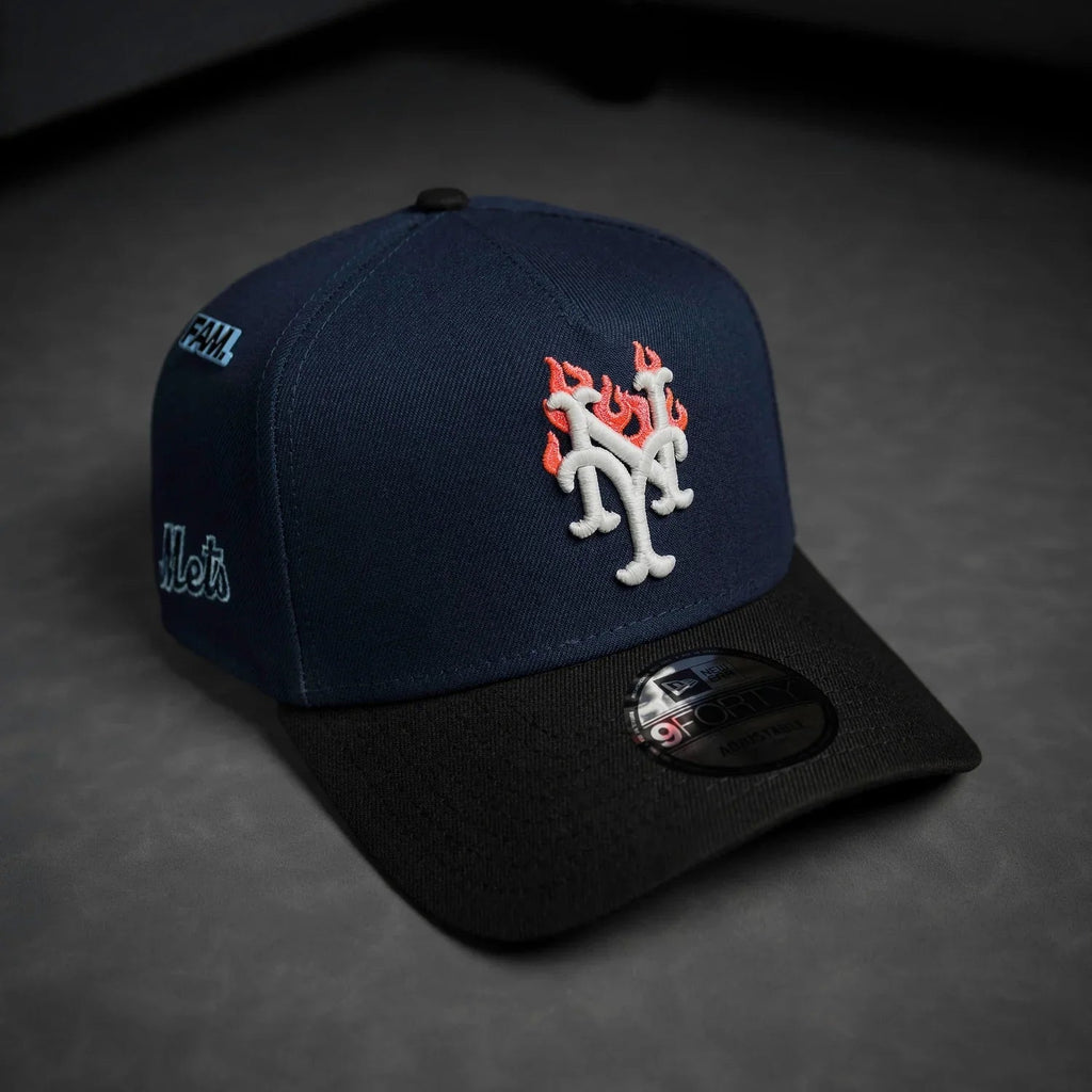 Navy blue and black baseball cap with logo on a dark background