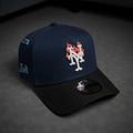 Navy blue and black baseball cap with logo on a dark background