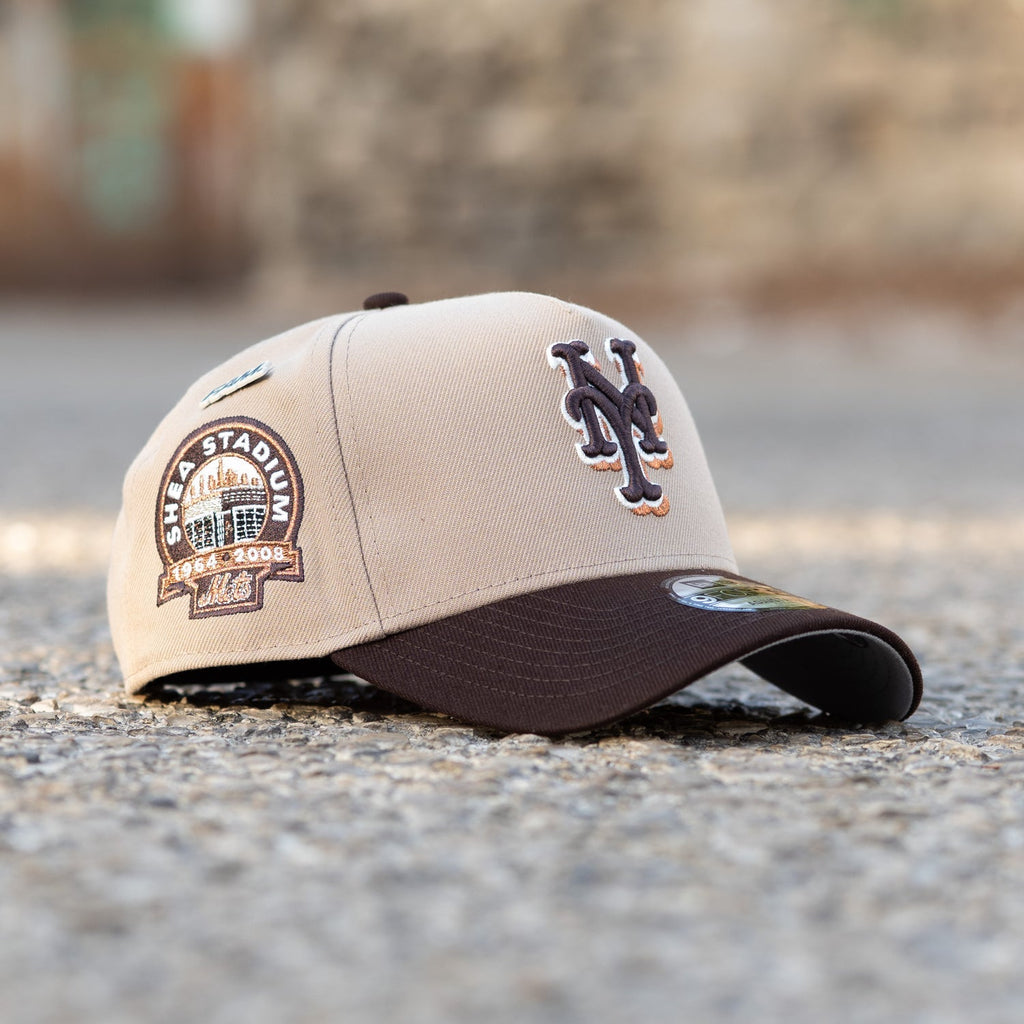 Beige and brown baseball cap with logo on a blurred background